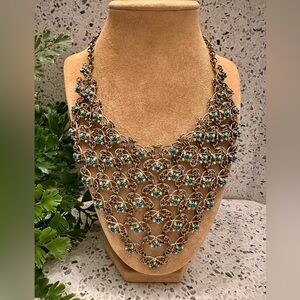 Gold tone Bib necklace accented with mint and teal gems